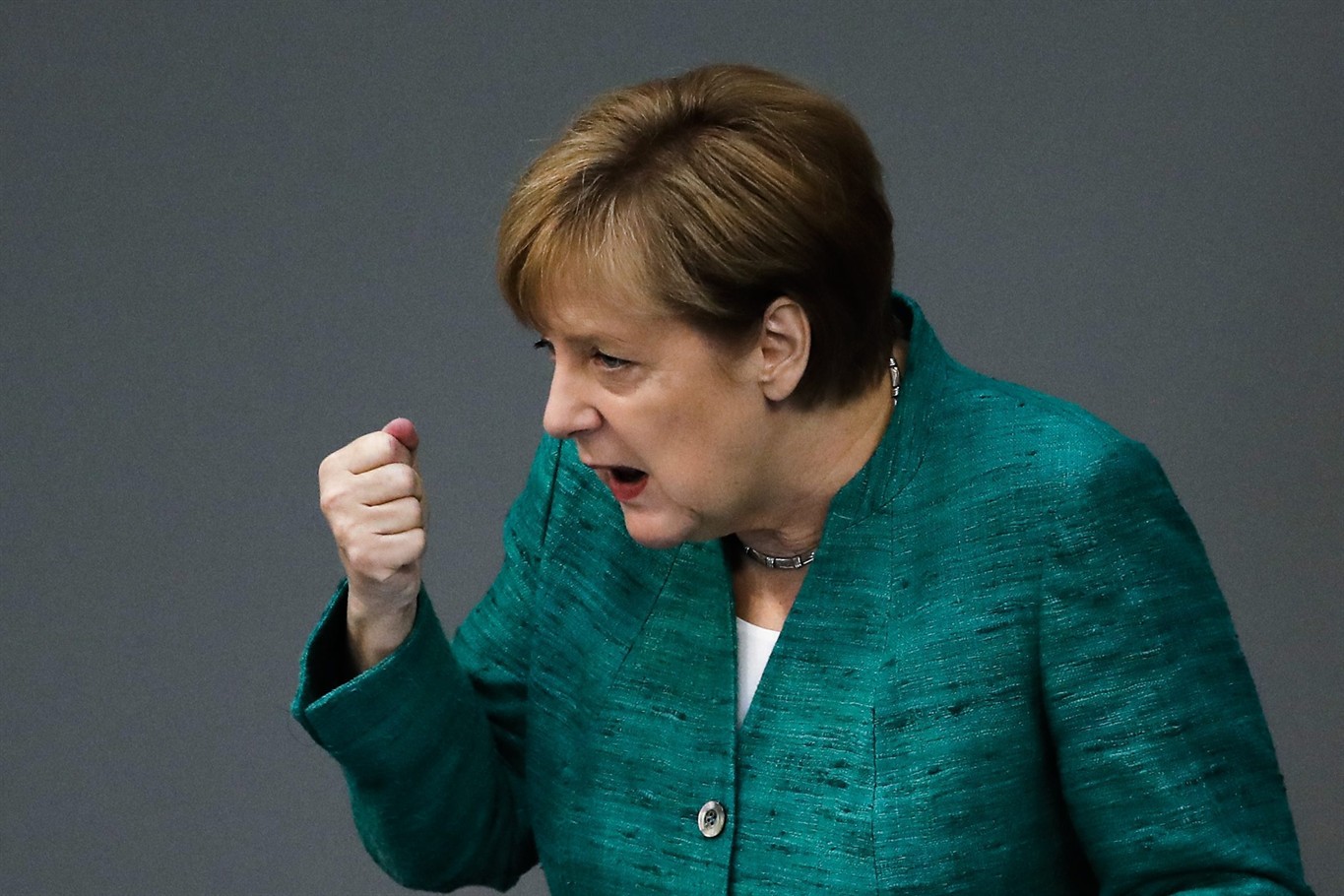 Merkel defends migrant record, calls for European solution